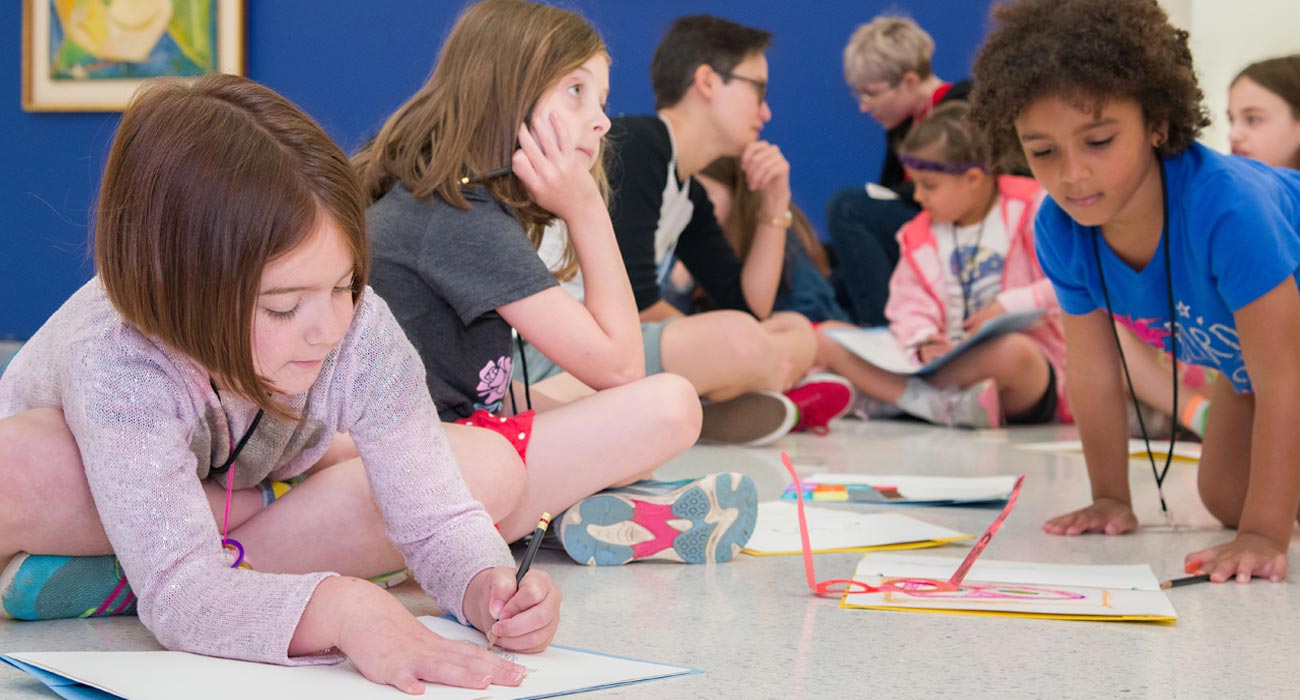 A group of kids drawing.