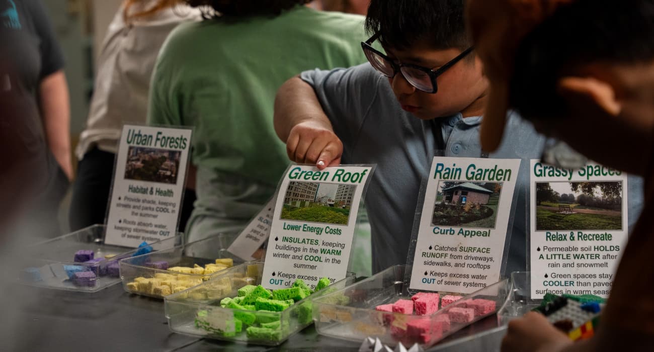 kids demonstrating different roof tiling