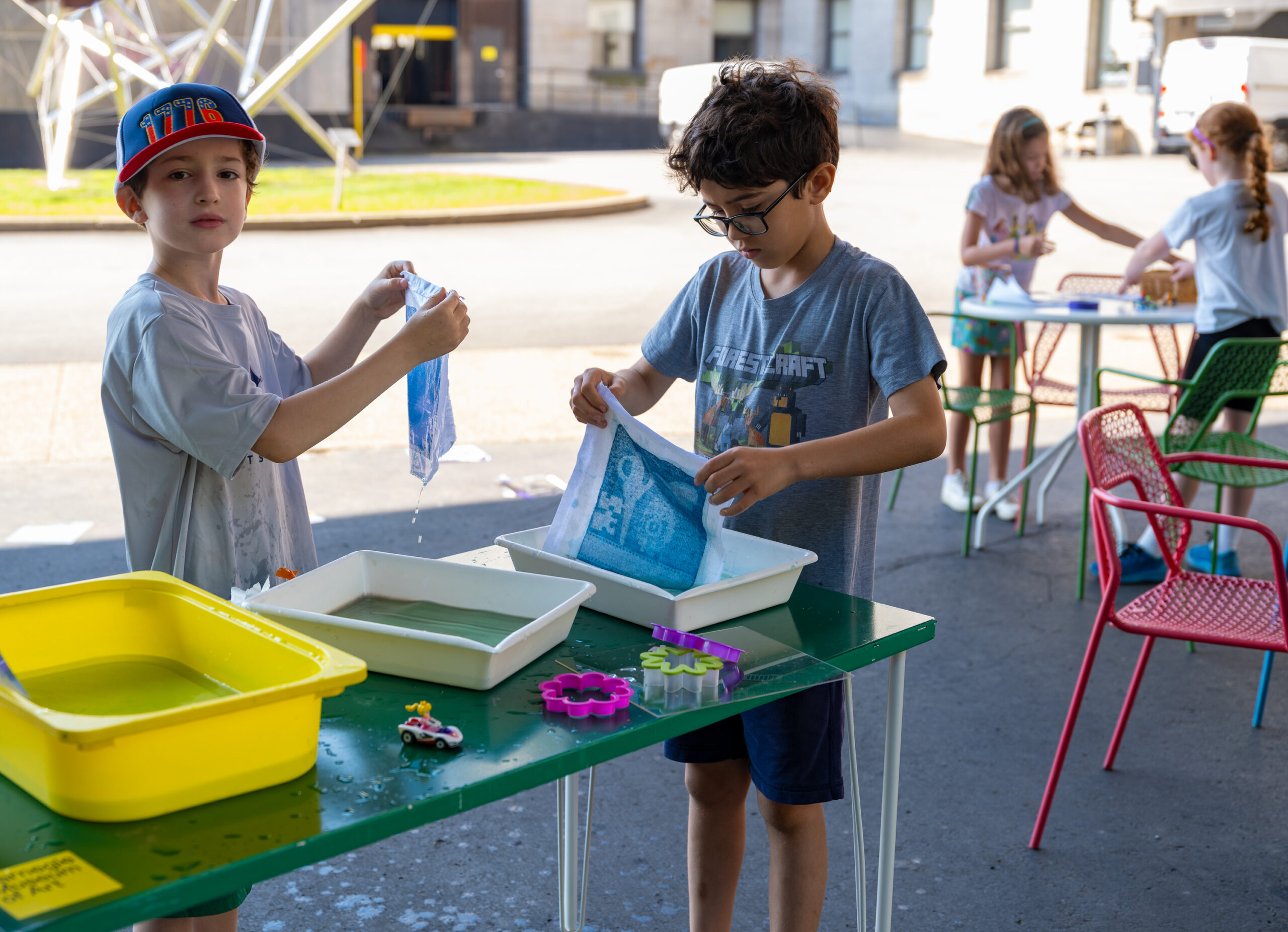 campers making photo prints outdoors