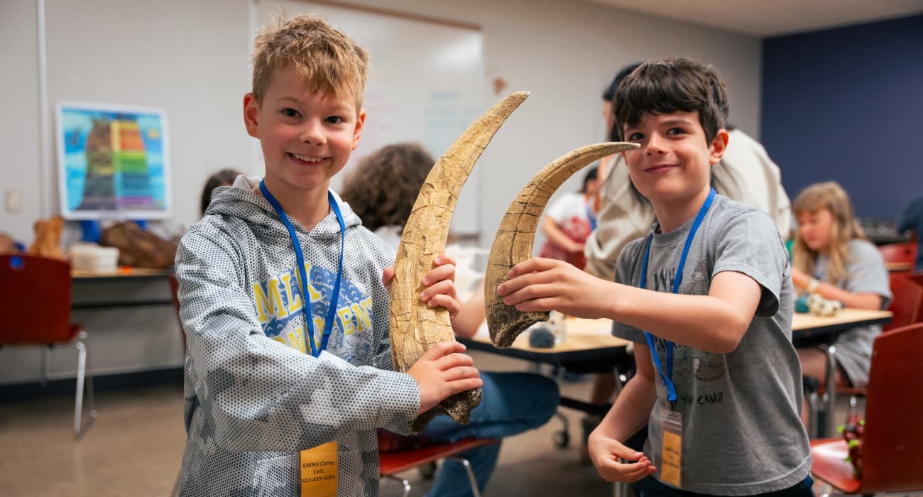 kids holding tusks